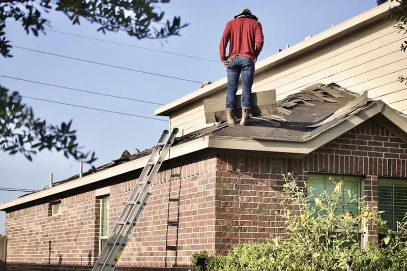 Professional roofer working on a residential roof in Middle River